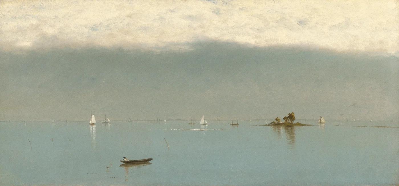 Dark storm clouds lift over a quiet shoreline as clear light returns across the water and distant land