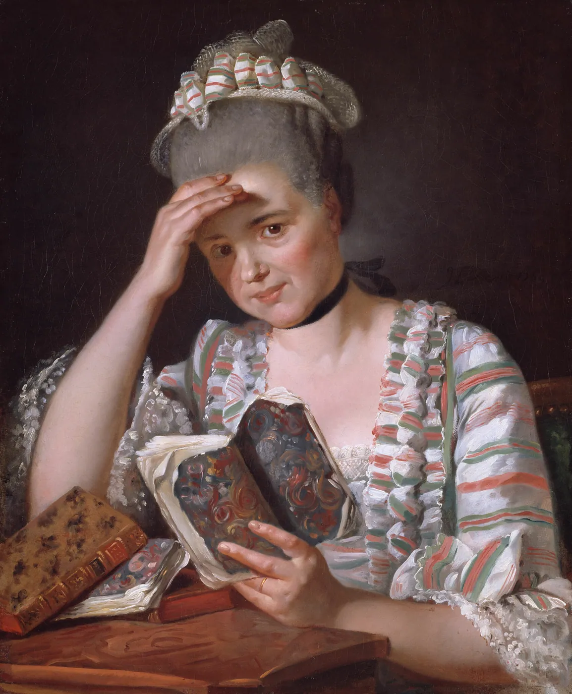 Painted portrait of a woman in a striped silk gown and lace cap, resting her head on one hand while reading a book at a table with other volumes