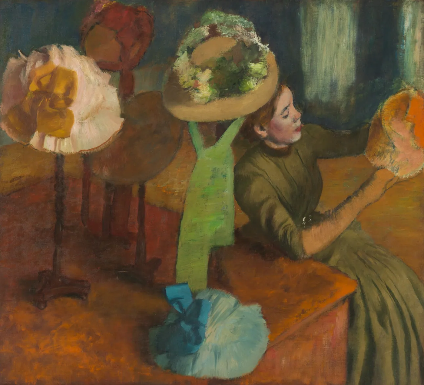 Painting of a woman in an olive dress at a shop counter examining a hat, with flower-trimmed hats on stands before her.