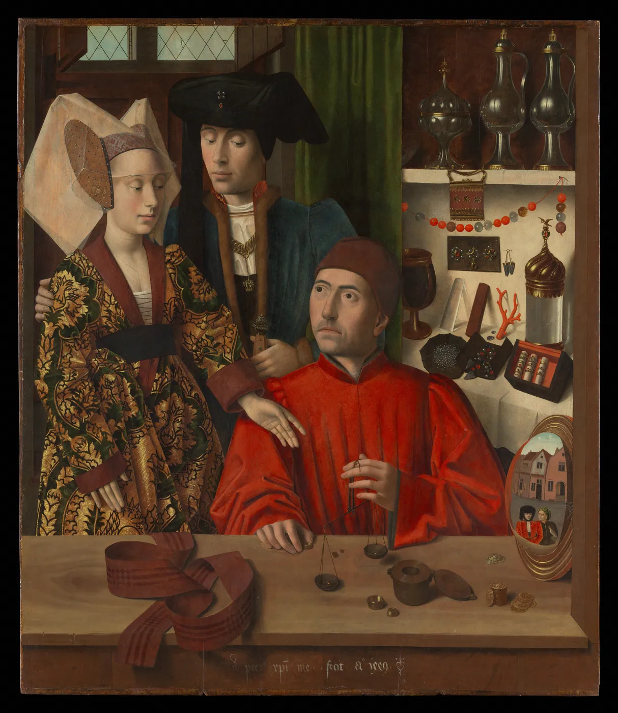 A goldsmith in a red robe weighs a ring on small scales while an elegantly dressed couple looks on, with shelves of jewels and vessels behind