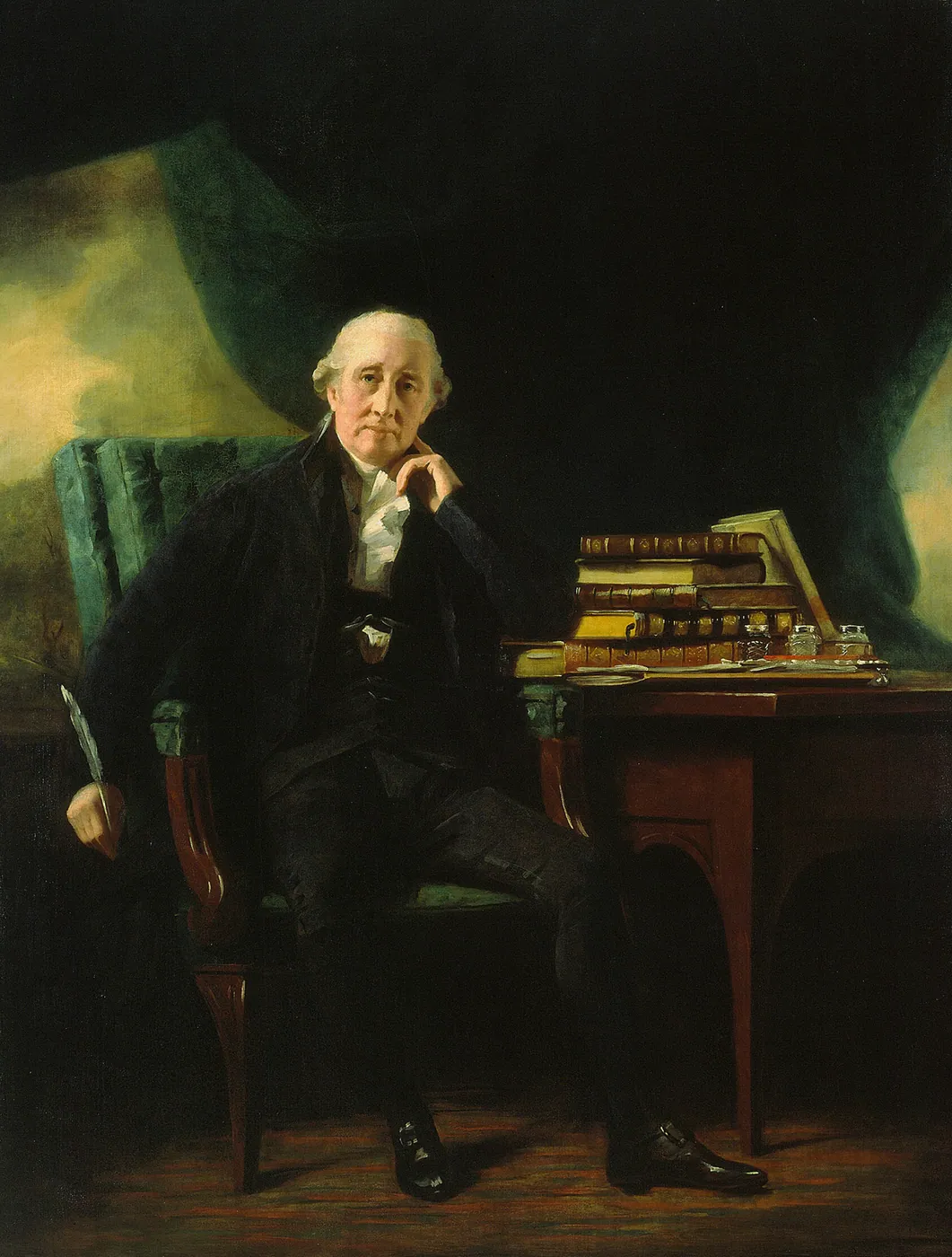 An elderly lawyer in black sits in a green armchair, chin on hand, beside a desk stacked with books and papers
